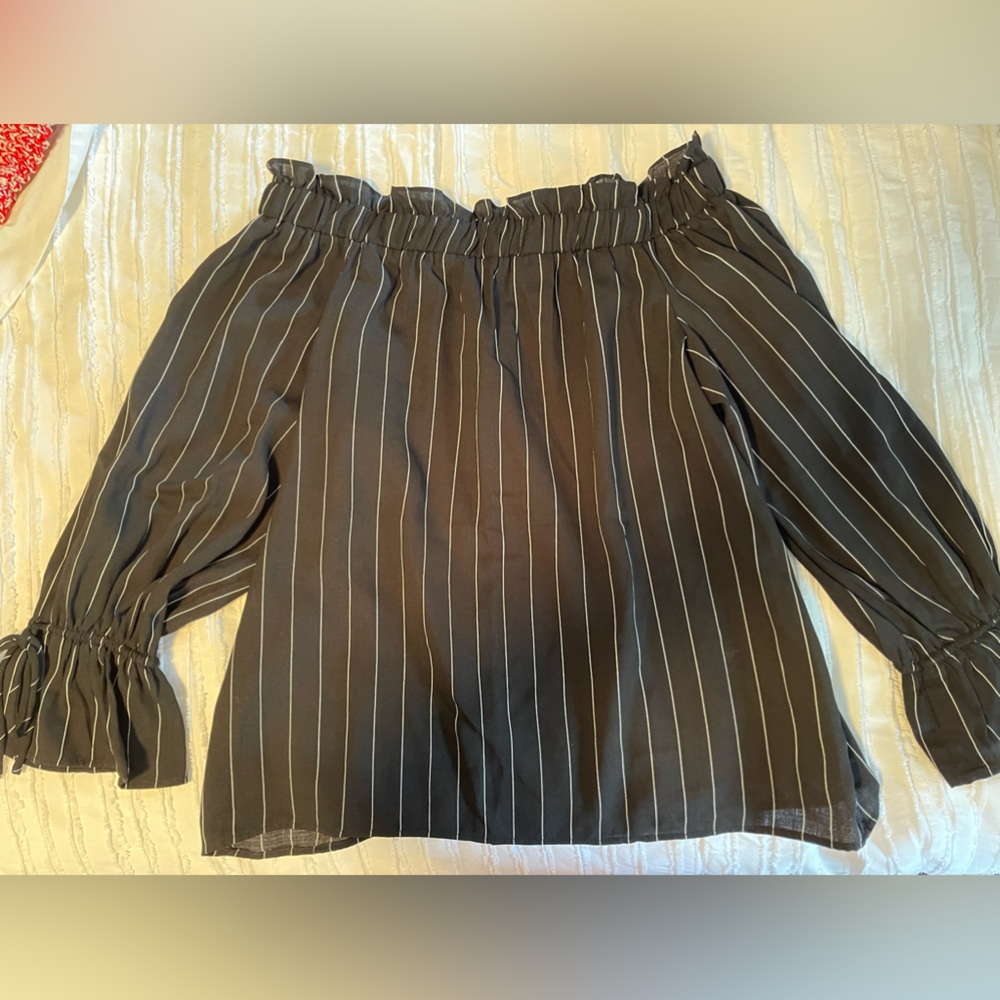 Gorgeous off the shoulder top in black with white stripes.